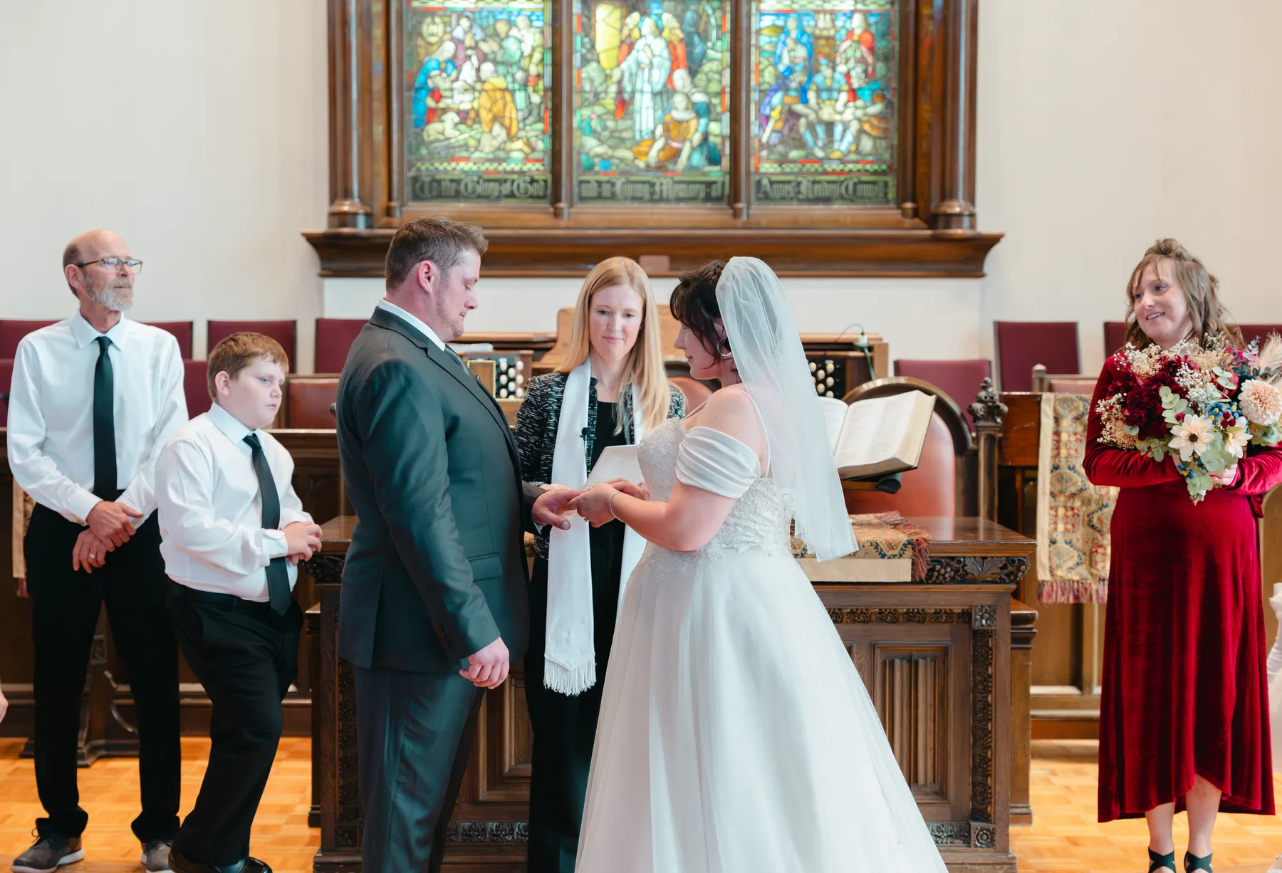 The couple and wedding party during the church ceremony at Kody and Jaz’s wedding.
