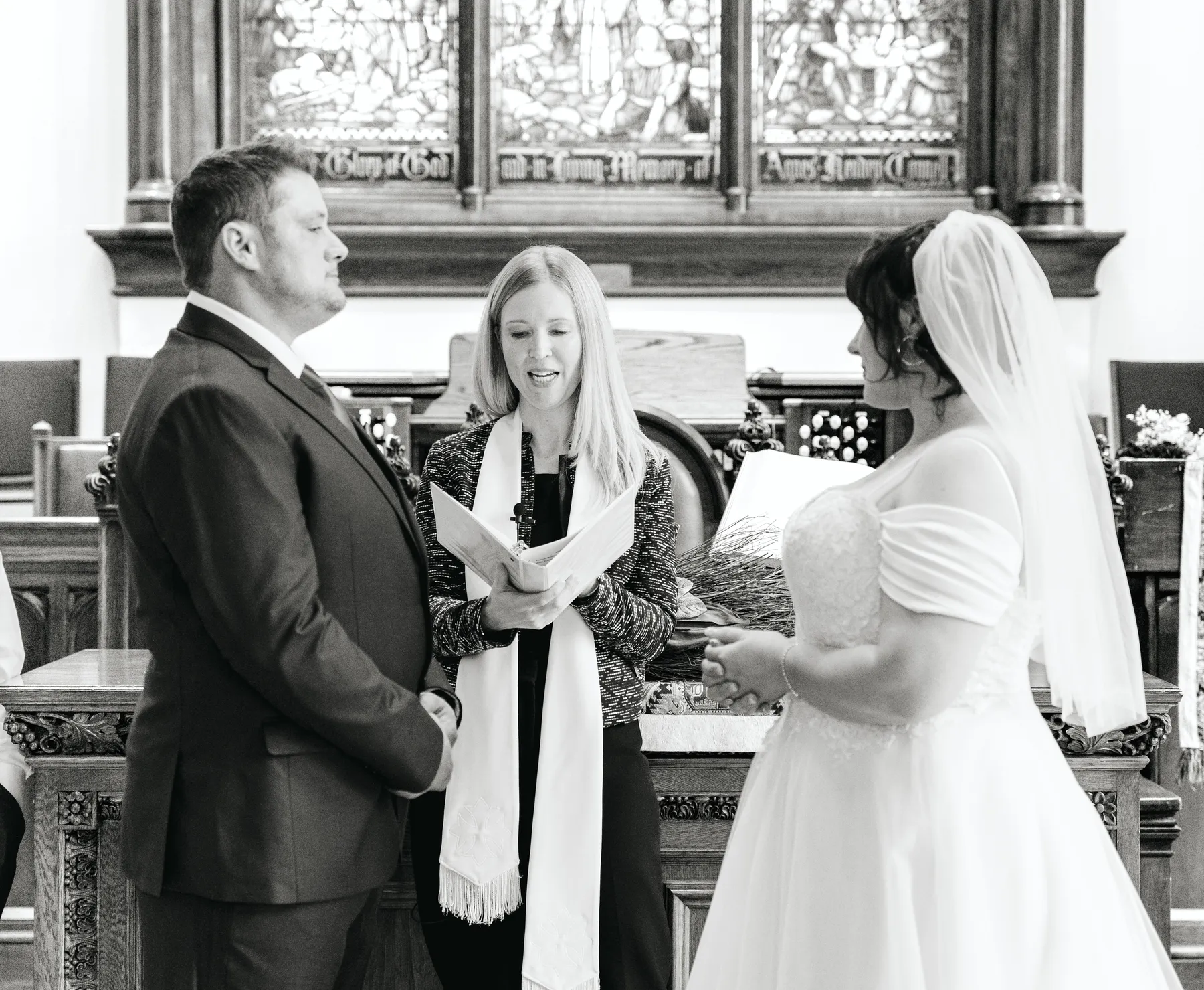 The couple embracing during the ceremony at Kody and Jaz’s wedding.