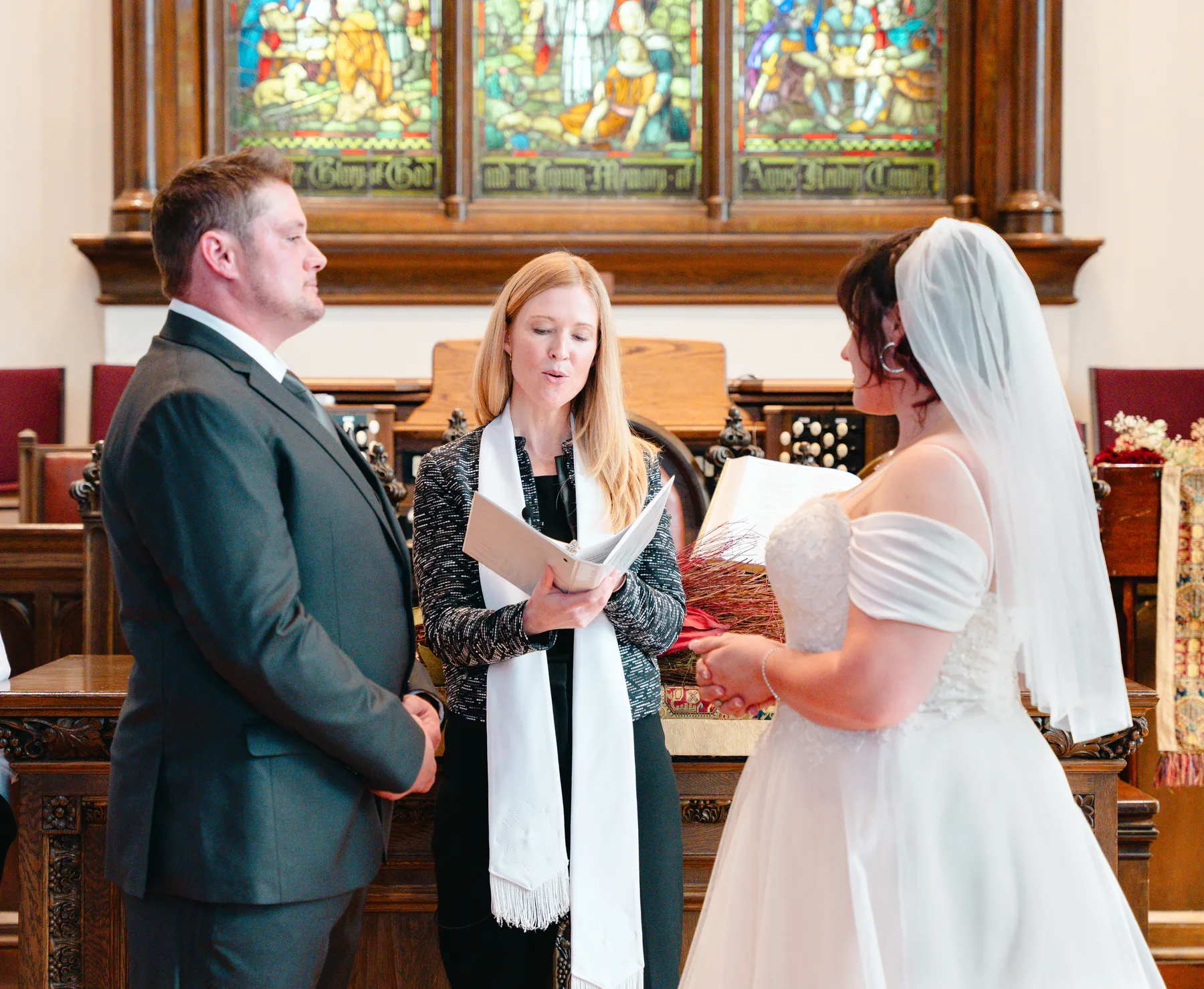 The couple embracing during the ceremony at Kody and Jaz’s wedding.