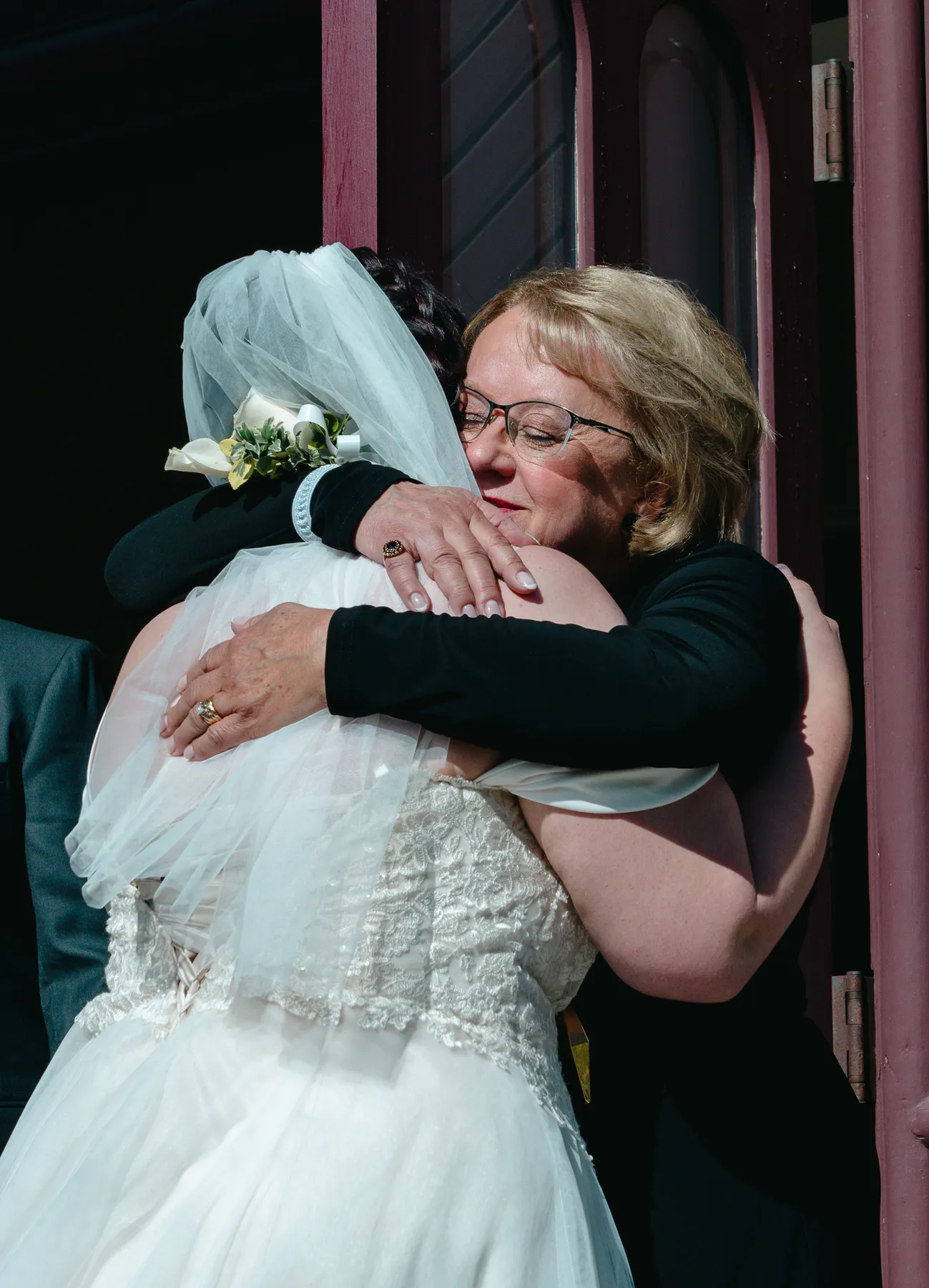 The bride greeting guests outside the church at Kody and Jaz’s wedding.