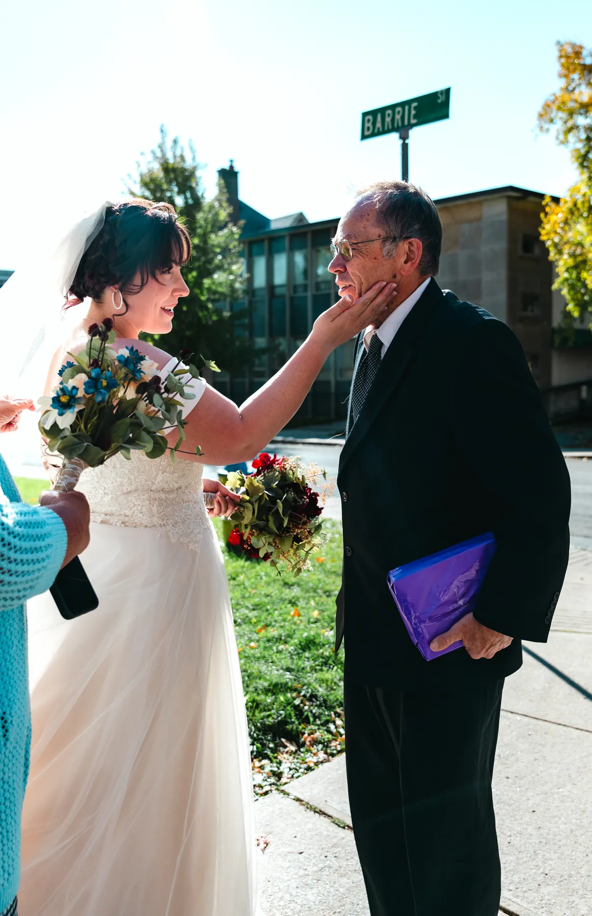 The bride with guests outdoors at Kody and Jaz’s wedding.