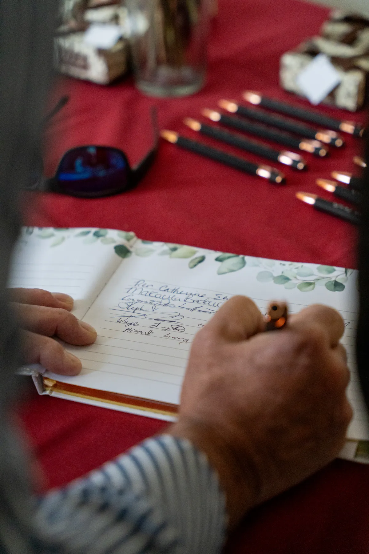 Guests signing the guest book at Kody and Jaz’s wedding.