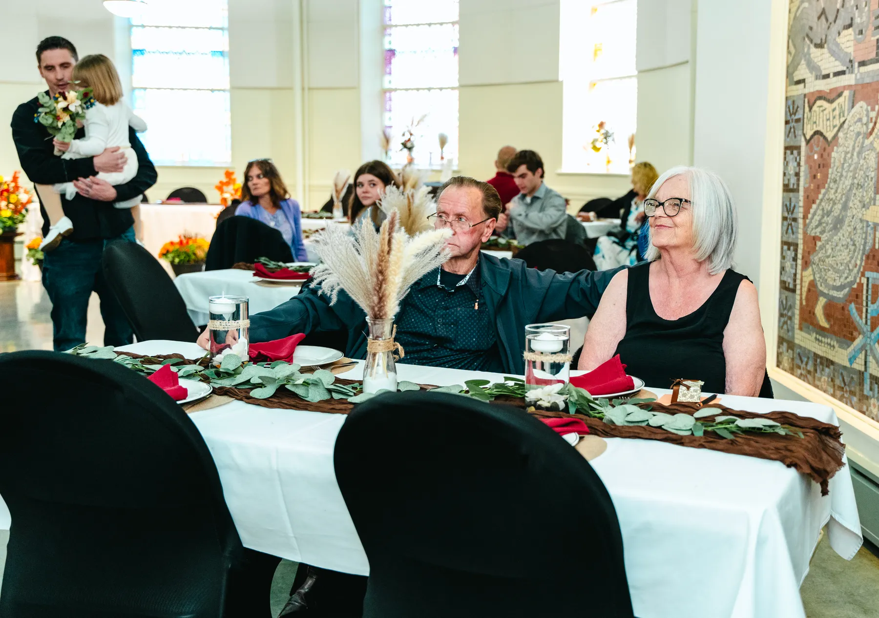 Guests at the reception tables at Kody and Jaz’s wedding.