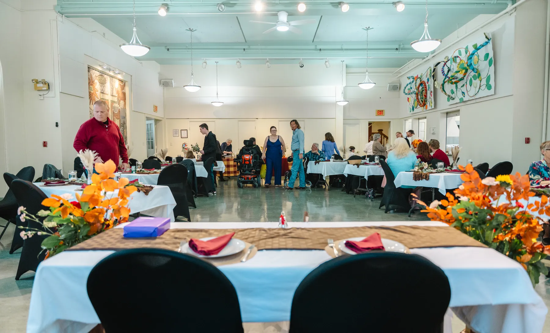 Details and guests in the reception room at Kody and Jaz’s wedding.