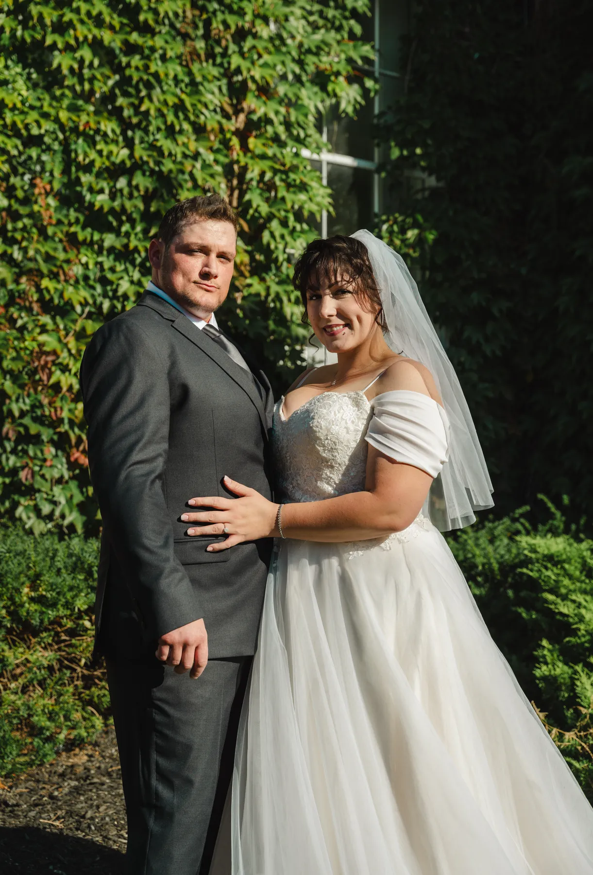 The couple posing in the garden at Kody and Jaz’s wedding.