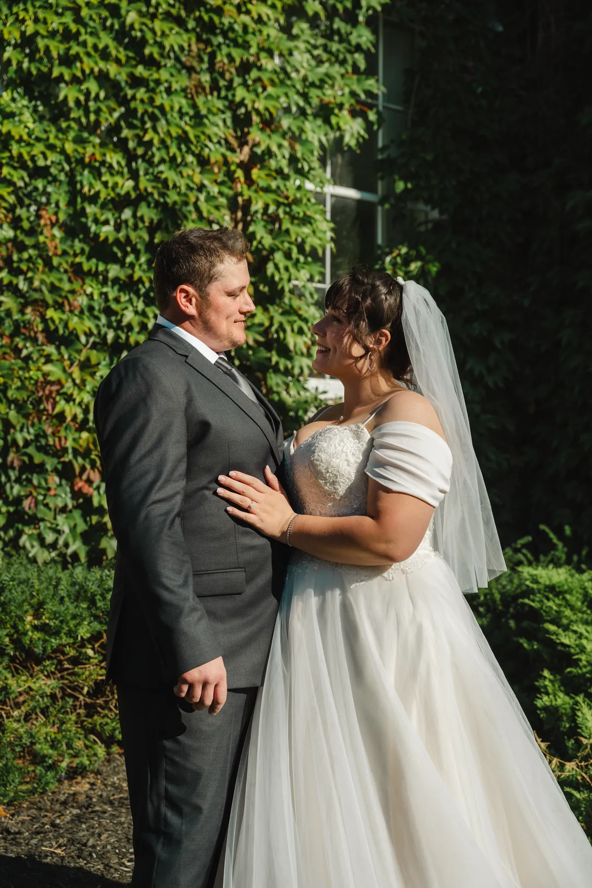 The couple posing in the garden at Kody and Jaz’s wedding.