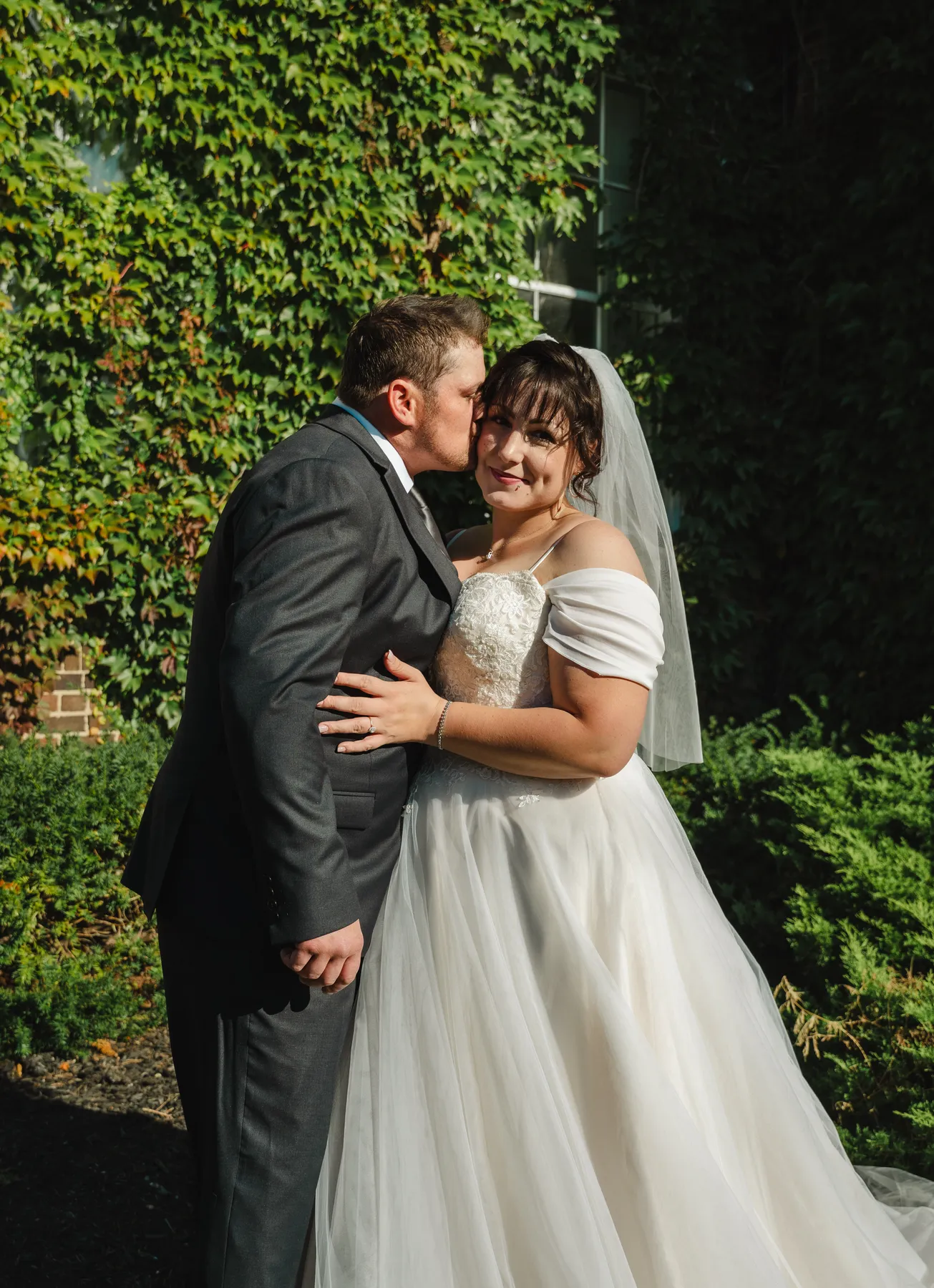 The couple posing in the garden at Kody and Jaz’s wedding.