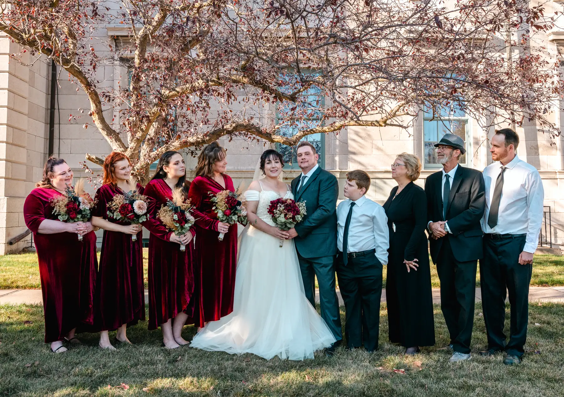 The wedding party posing outdoors at Kody and Jaz’s wedding.