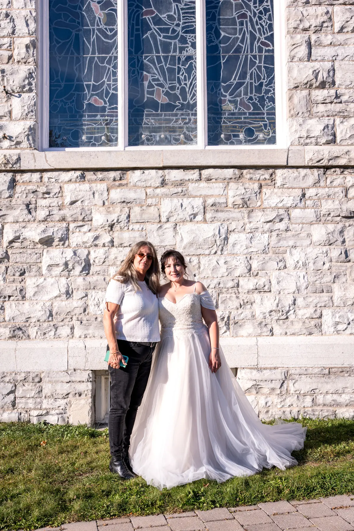 The bride posing outside the church at Kody and Jaz’s wedding.