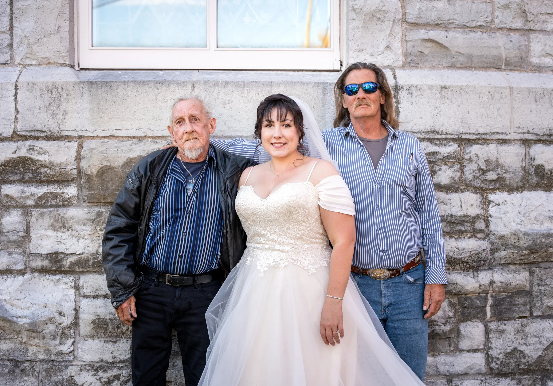The bride with guests outside the church at Kody and Jaz’s wedding.