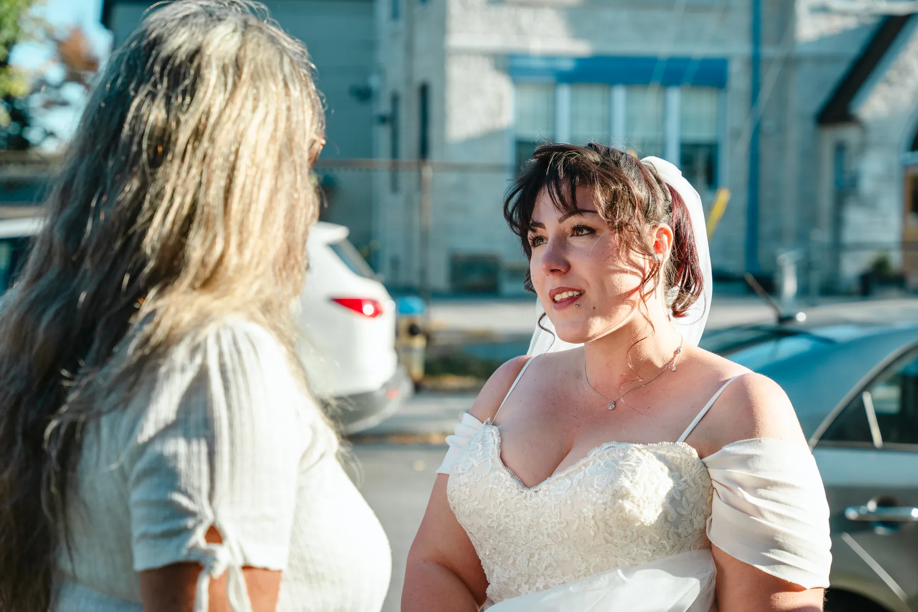 The bride with a guest at the reception at Kody and Jaz’s wedding.