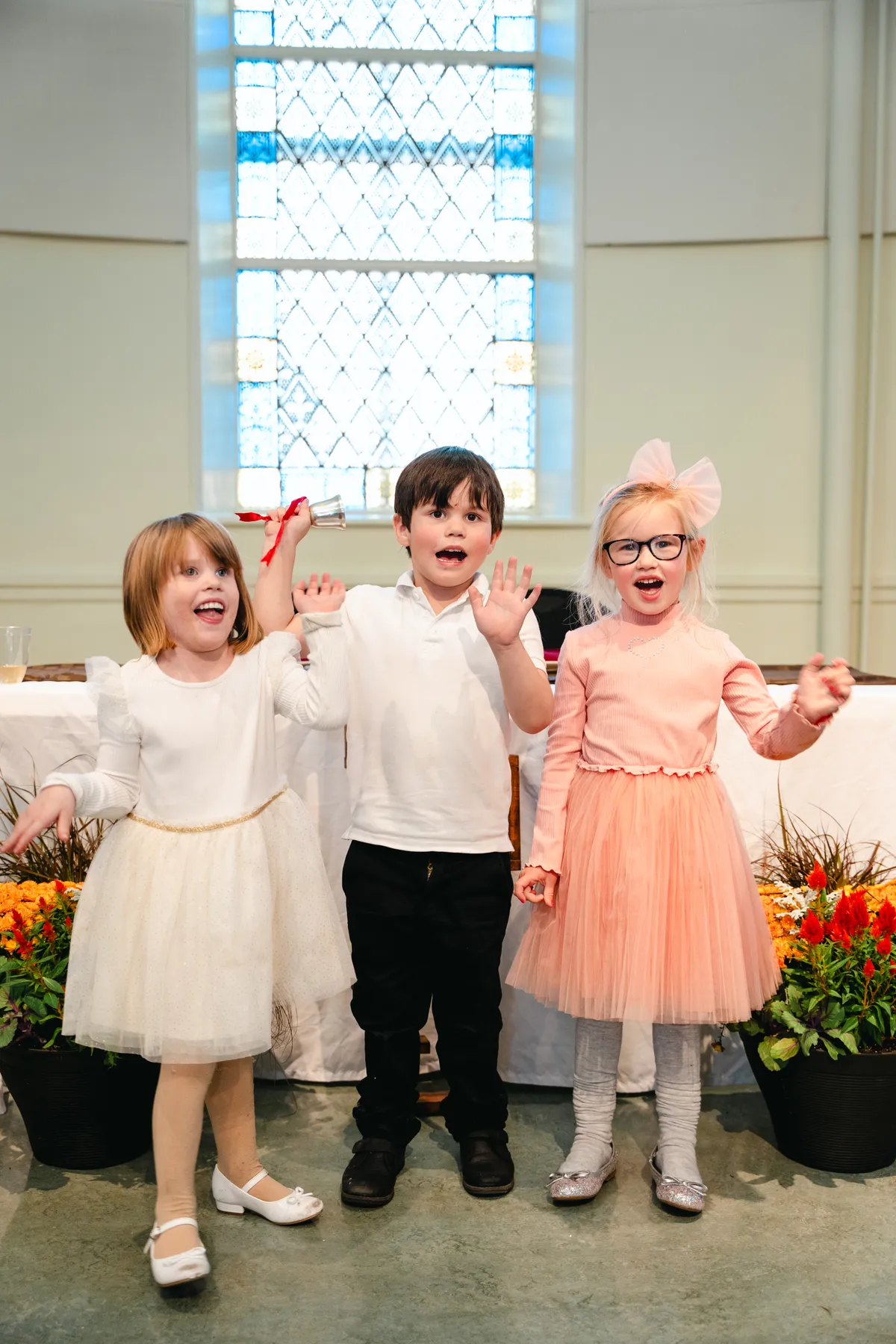 Children posing at the reception at Kody and Jaz’s wedding.