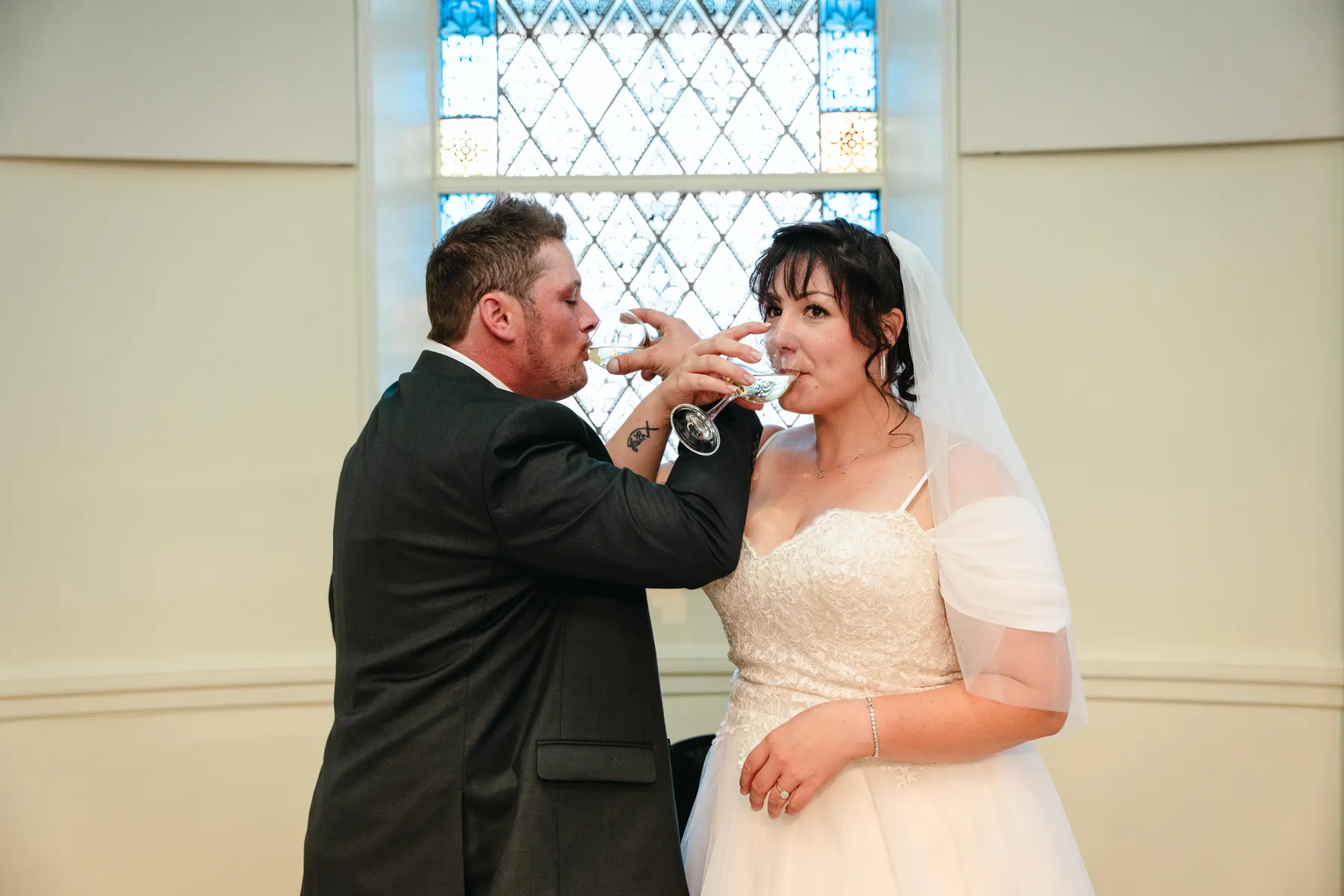 The couple feeding each other wedding cake at Kody and Jaz’s wedding.