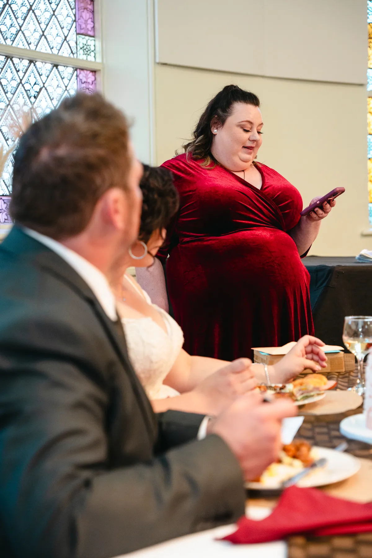 A guest speaking near the couple at Kody and Jaz’s wedding.