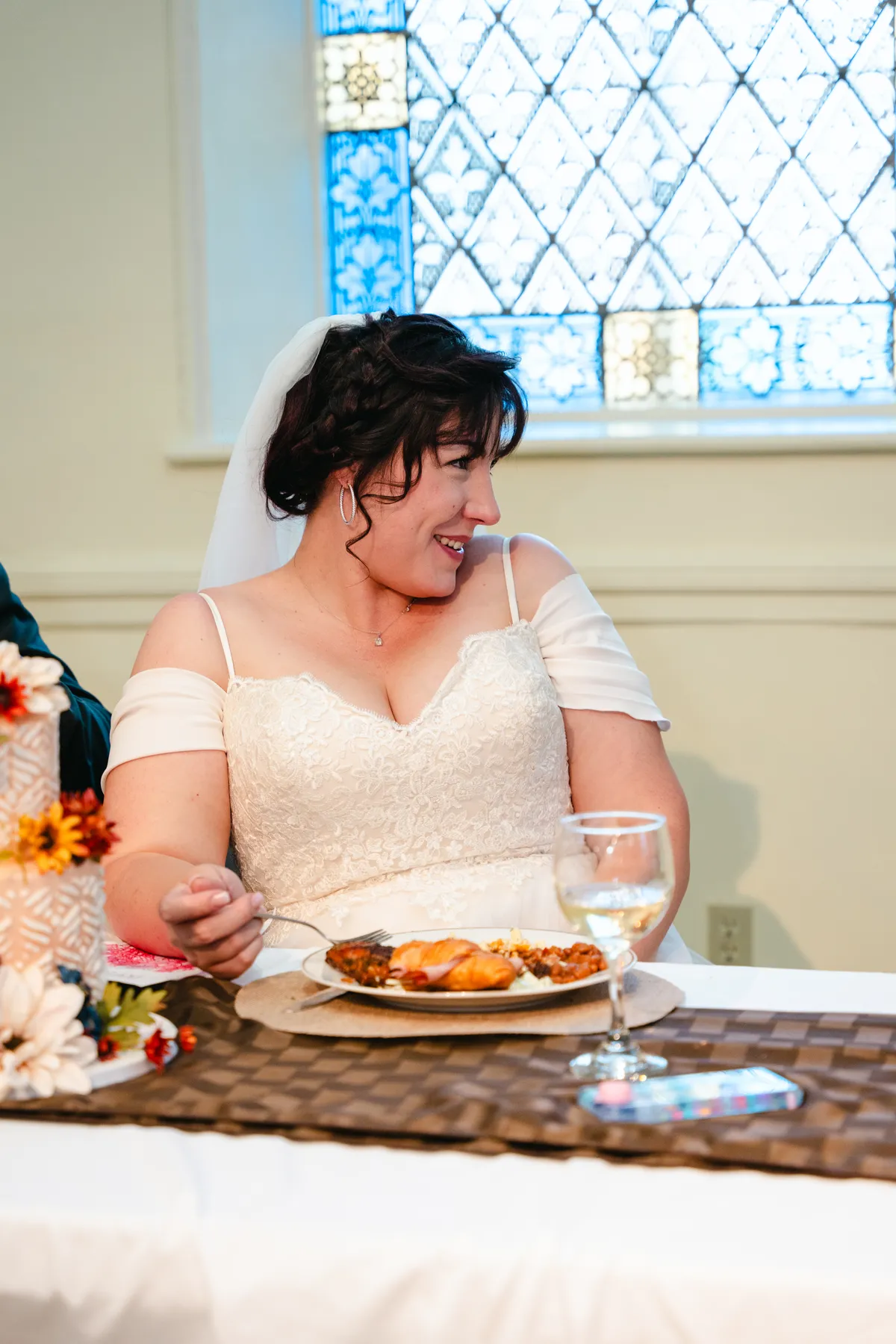 The bride greeting and hugging guests at Kody and Jaz’s wedding.