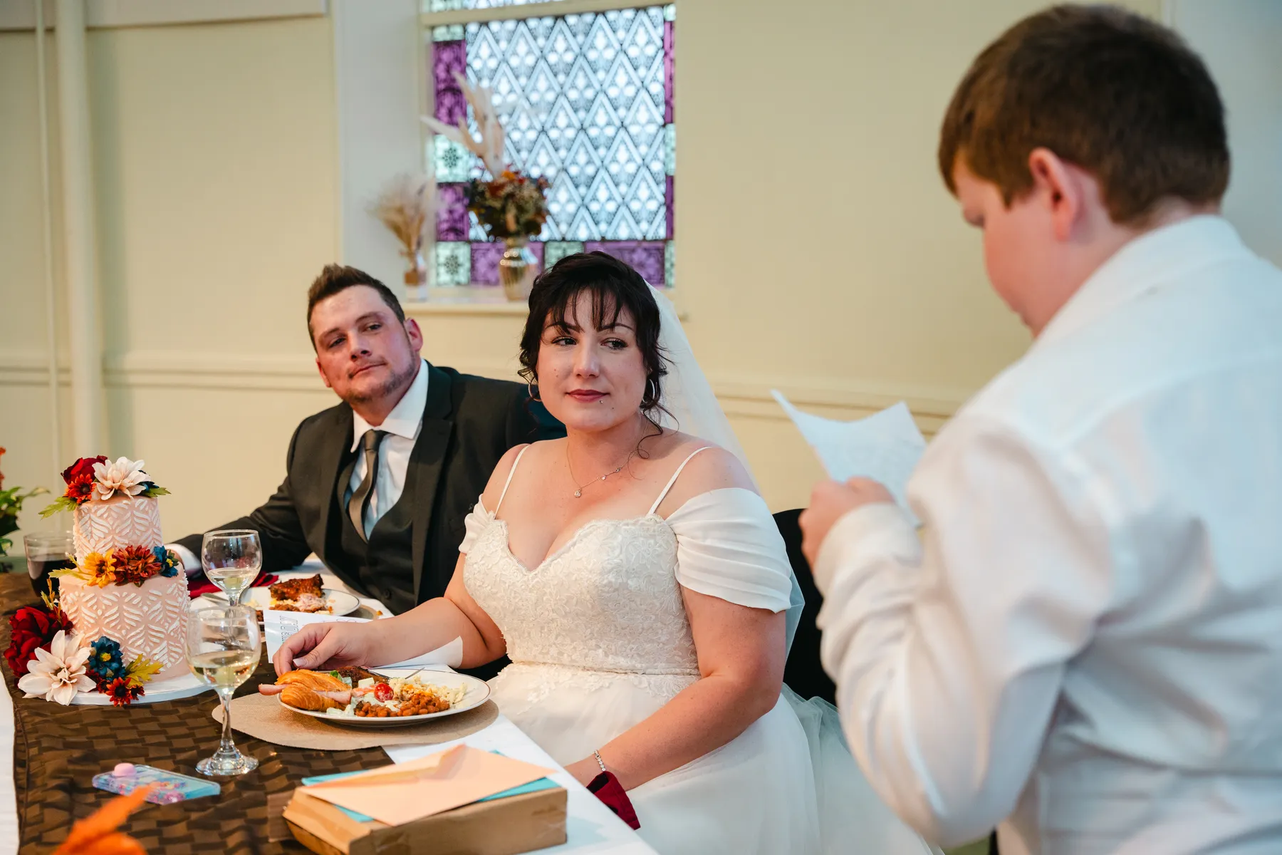 The bride greeting and hugging guests at Kody and Jaz’s wedding.