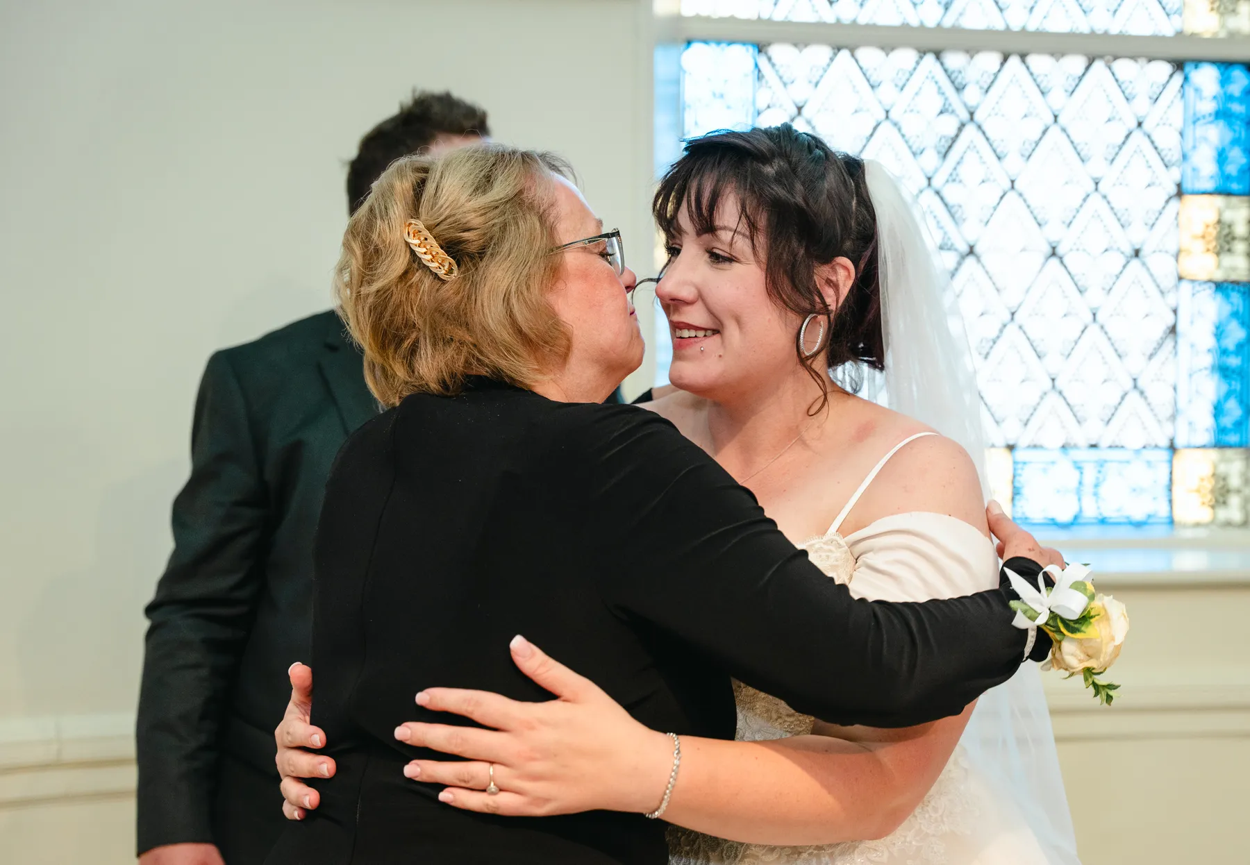 The couple and guests reacting to the speeches at Kody and Jaz’s wedding.