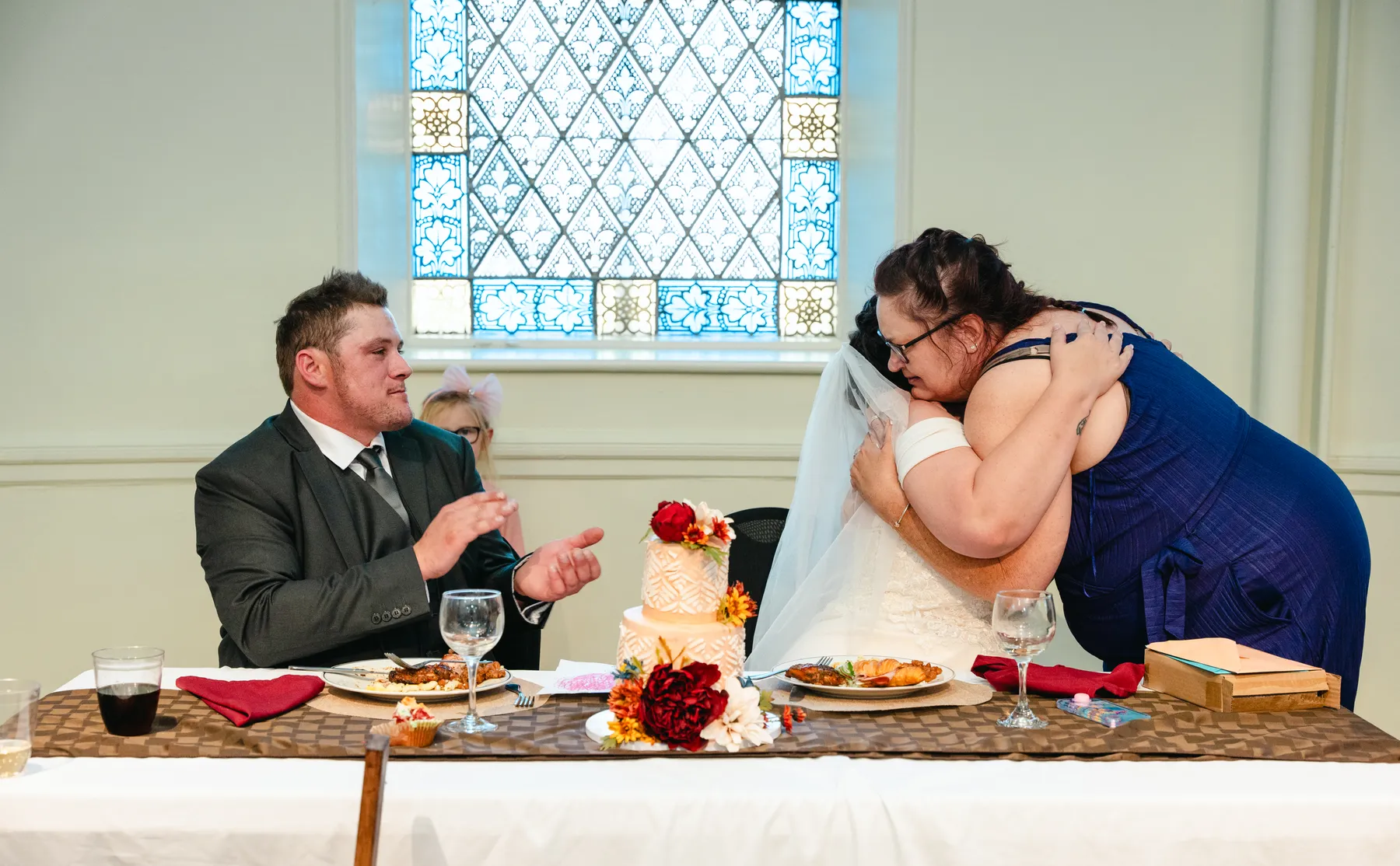The couple at the head table during speeches at Kody and Jaz’s wedding.