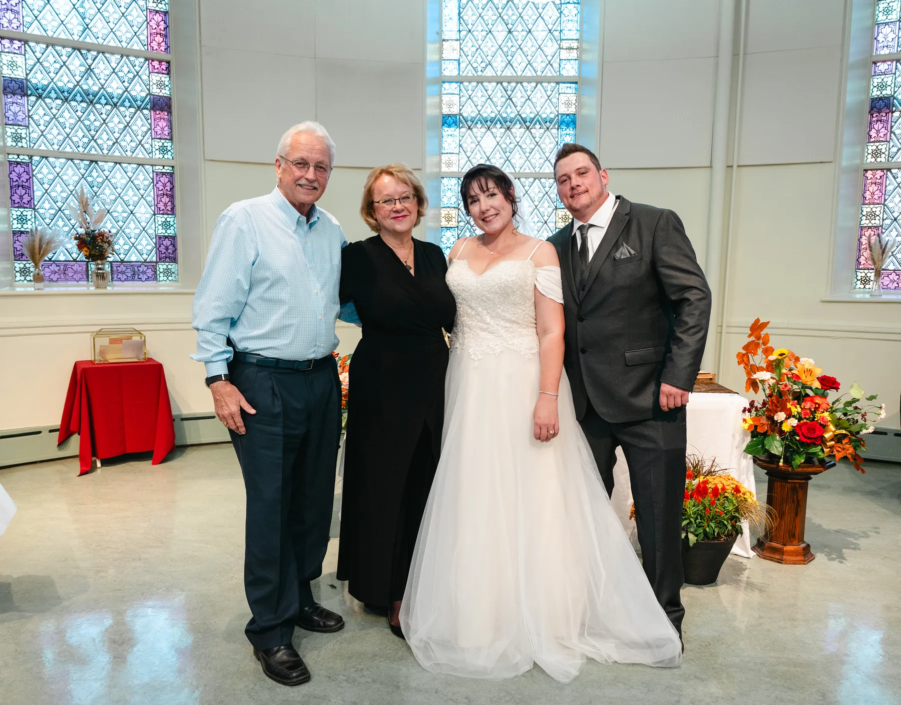 The couple with guests at the reception at Kody and Jaz’s wedding.