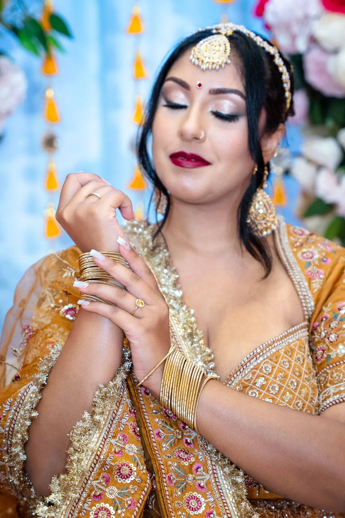 Portraits and outfit details of a woman in gold at Jessie and Erin’s Haldi celebration.