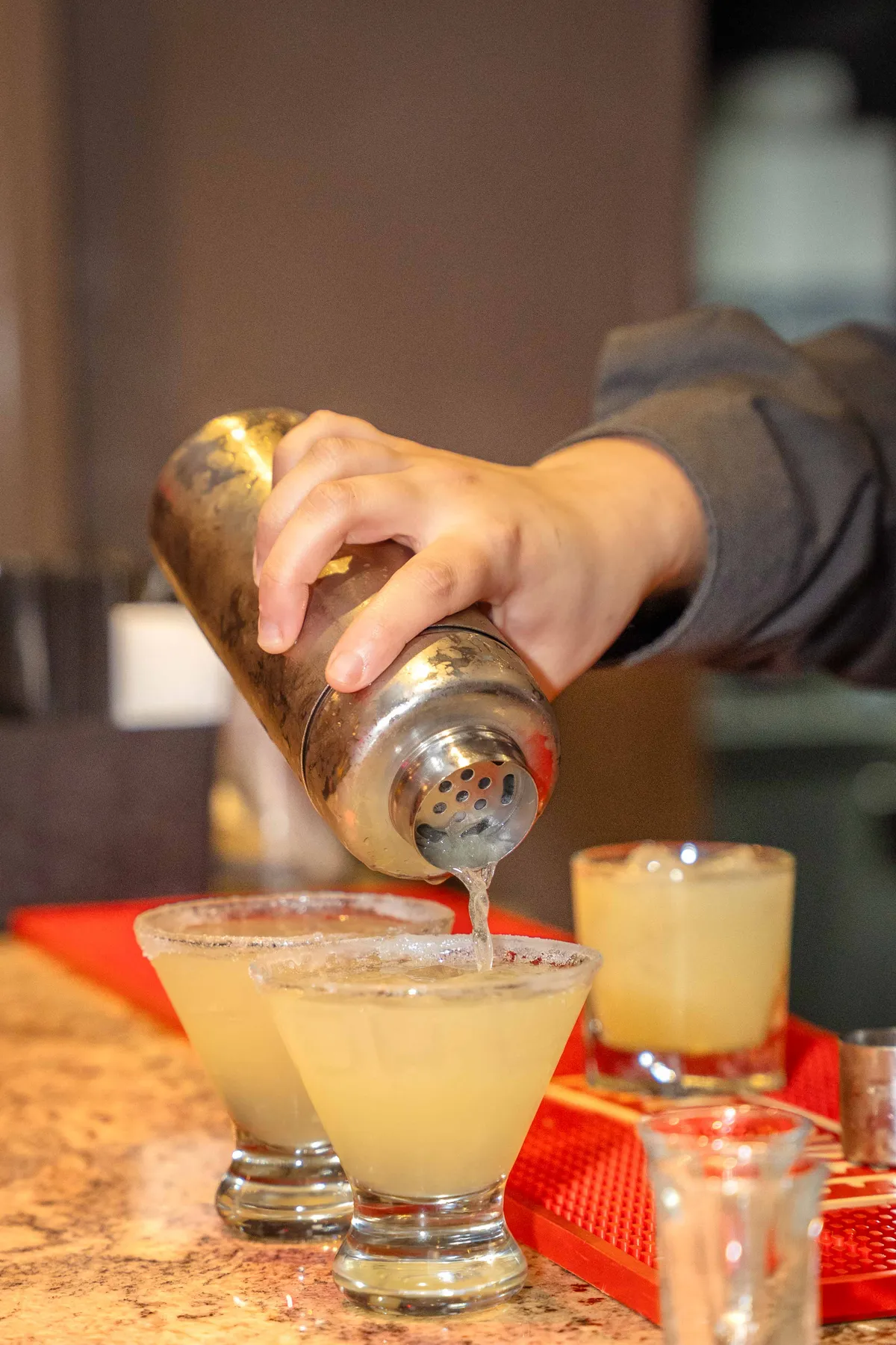 A drink being poured at the bar at Jessie and Erin’s Haldi celebration.