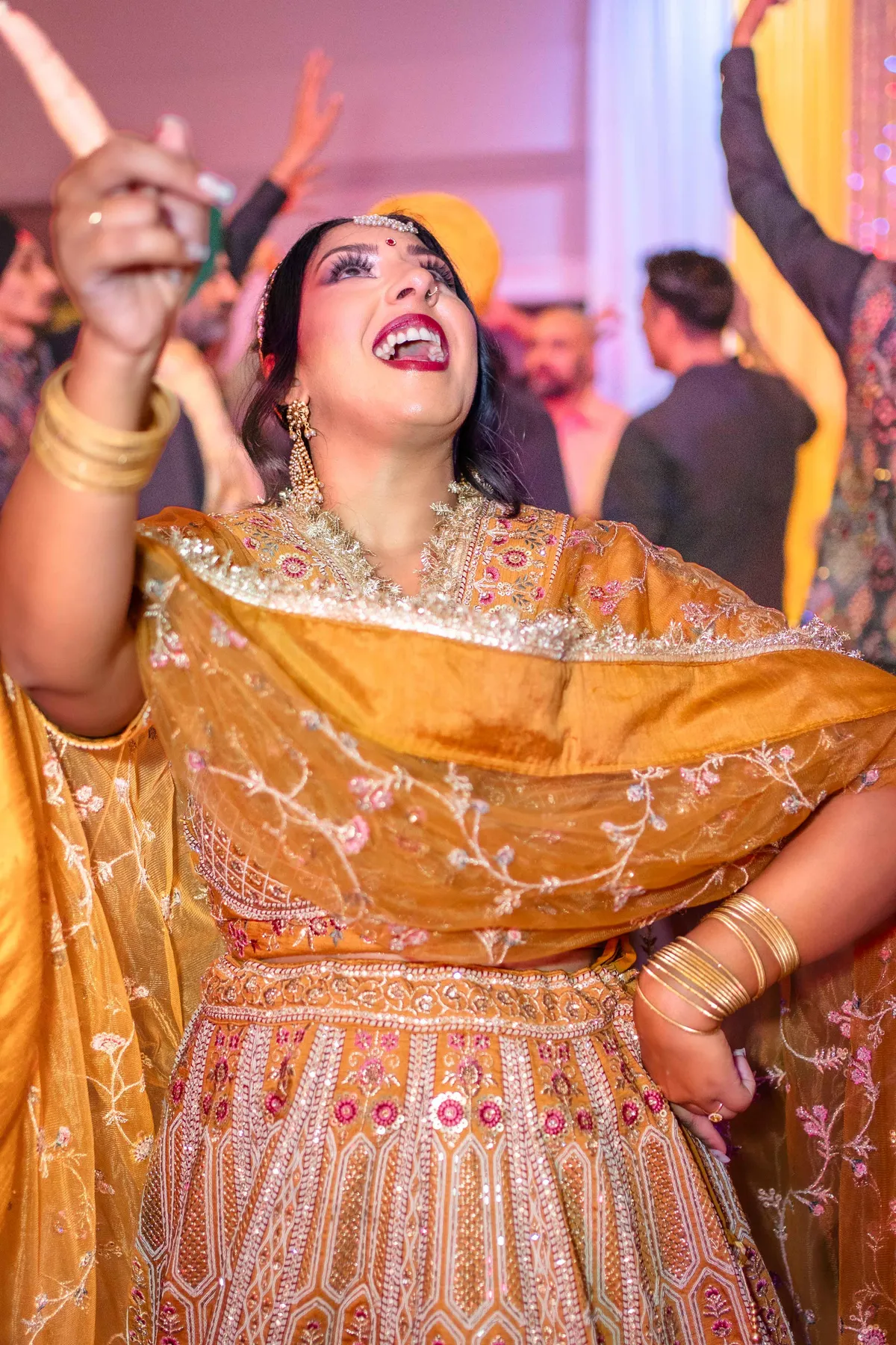 Guests enjoying the dance floor at Jessie and Erin’s Haldi celebration.
